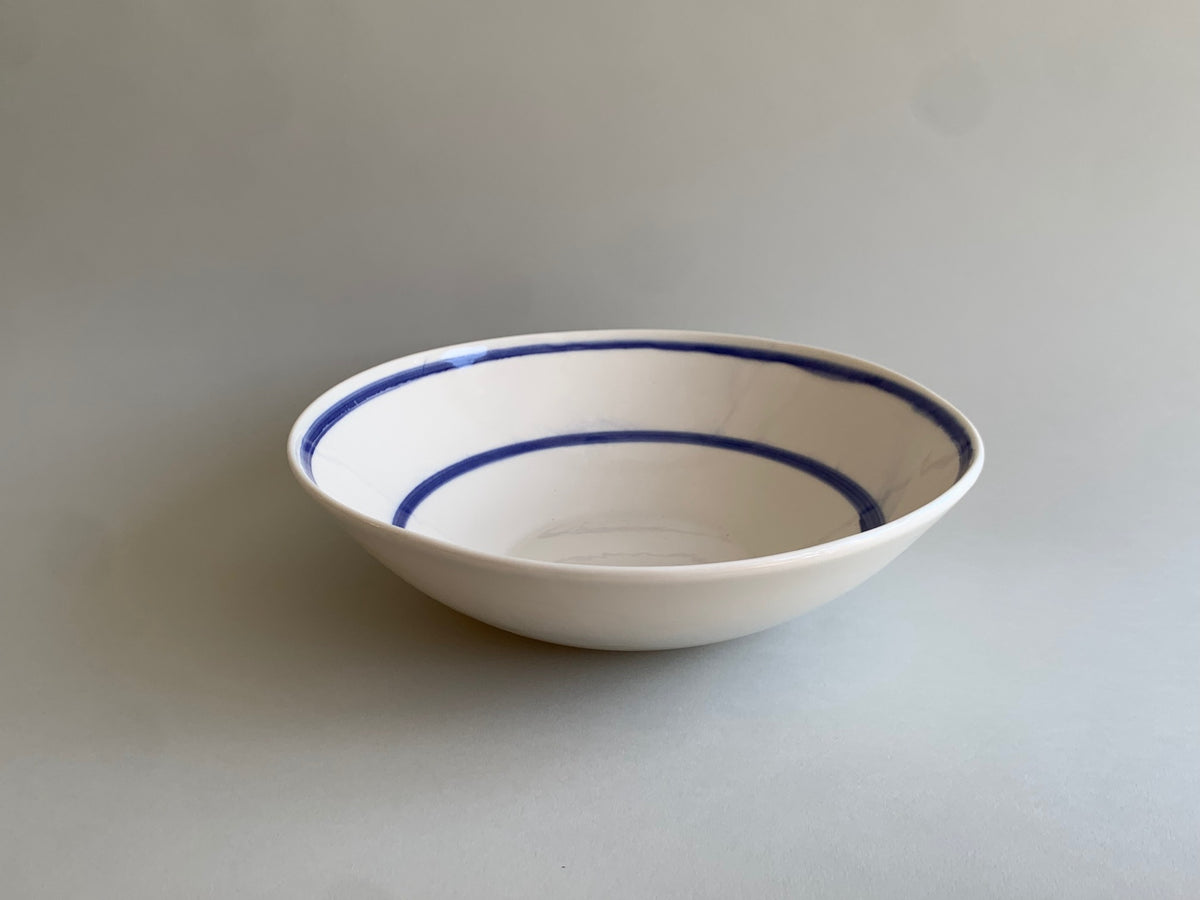 Cobalt blue line handmade porcelain salad bowl, side view